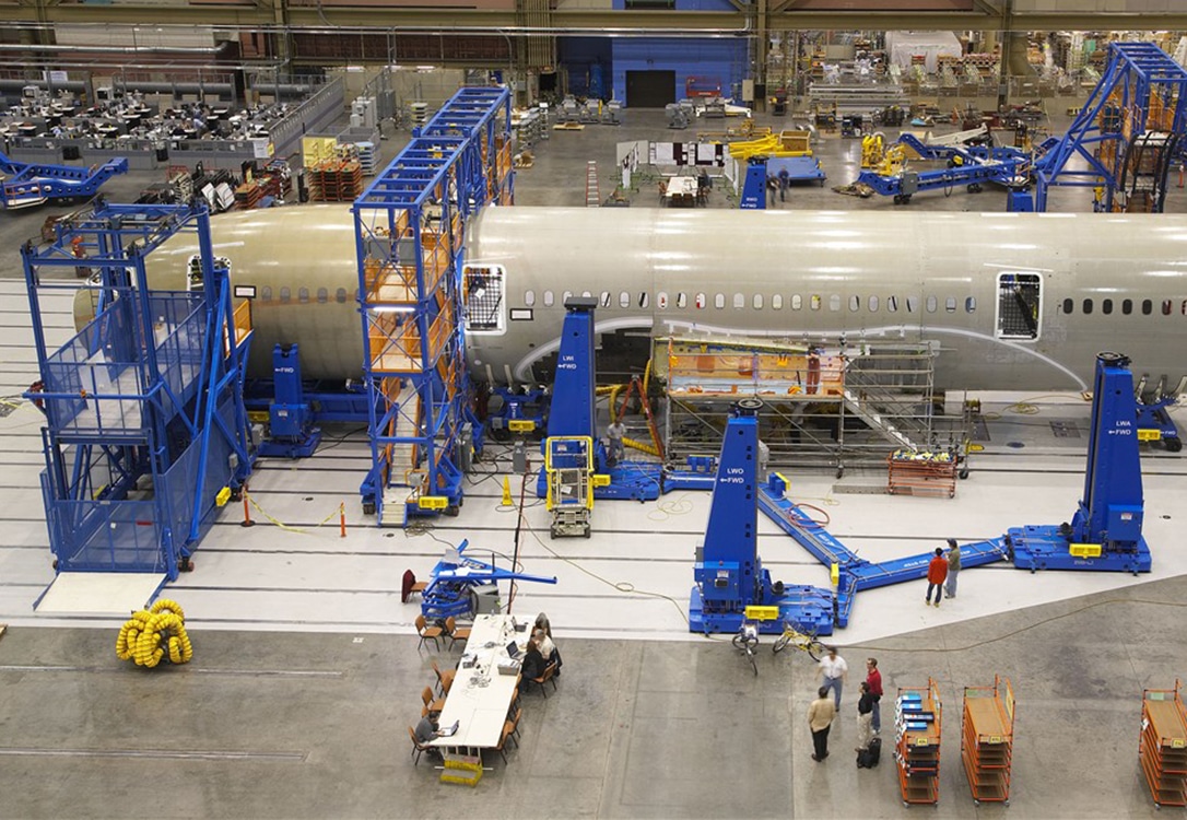 Vertical reciprocating conveyors are used for the careful handling of airplane parts.