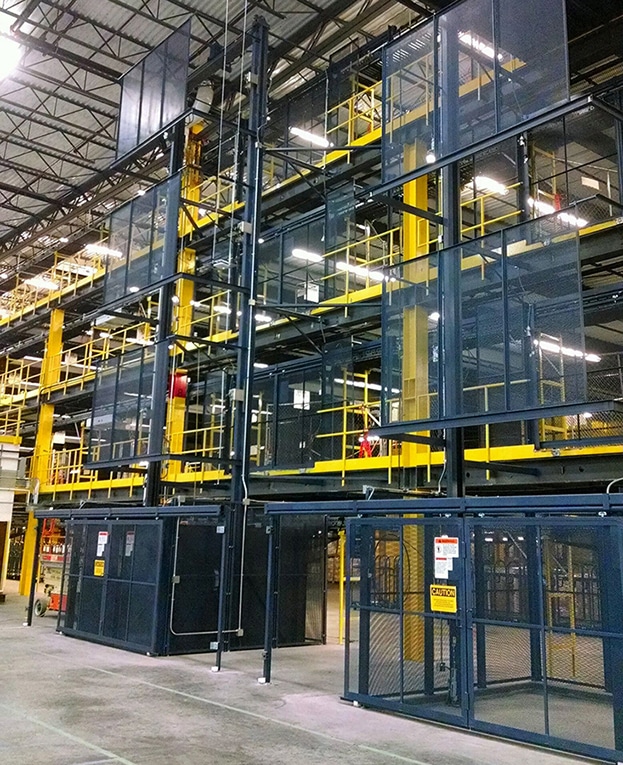 A PFLow Industries Amazon M vertical reciprocating conveyor.