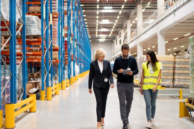 Warehouse managers communicating with customers
