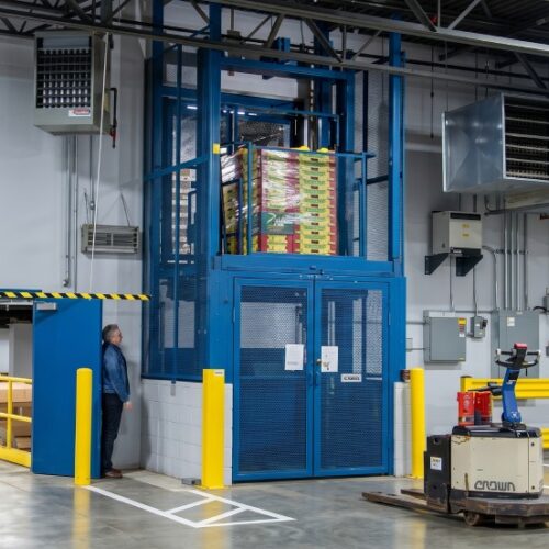 Pflow's M Series mechanical vertical lift in action at a produce wholesaler facility