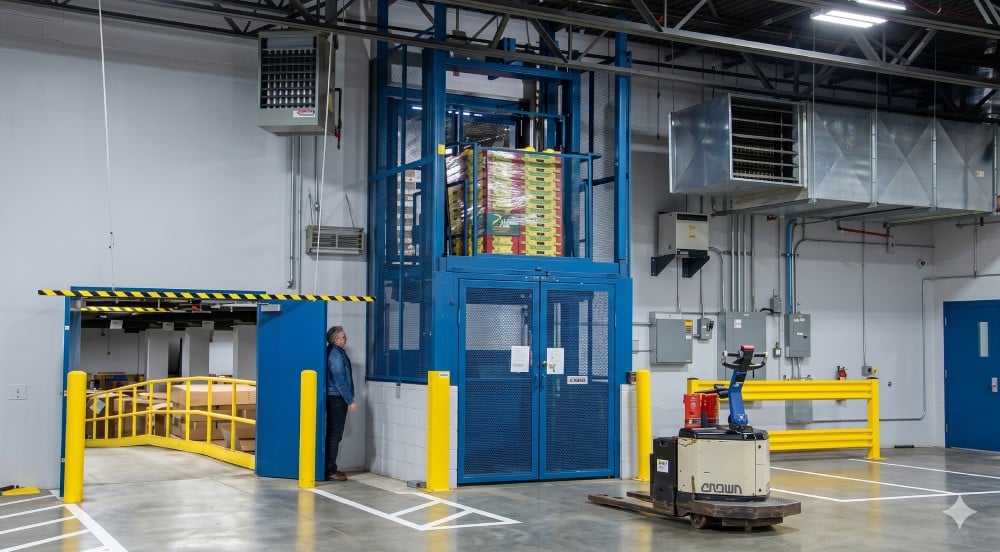 Pflow's M Series mechanical vertical lift in action at a produce wholesaler facility